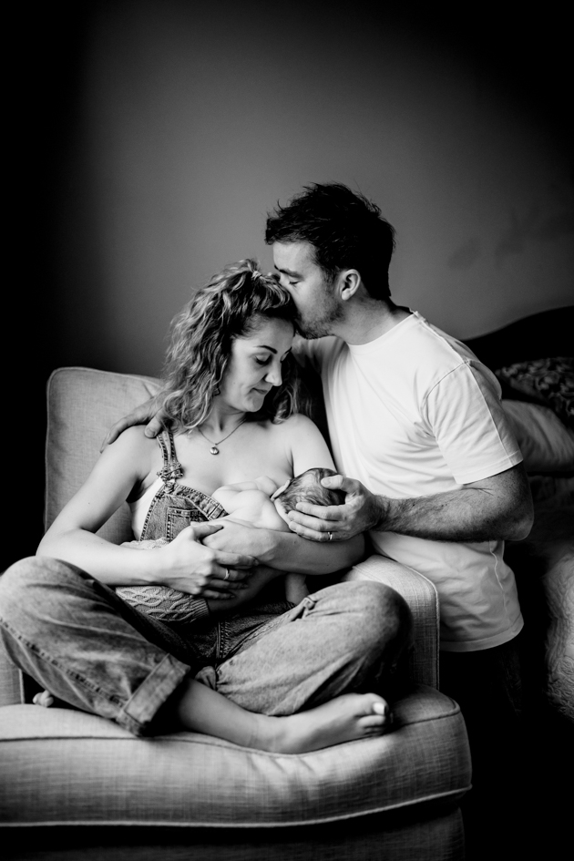 Mum, Dad and newborn baby having their in-home newborn photography session in York