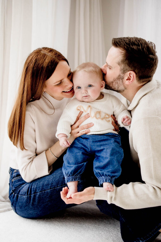 Mum, Dad and Baby at photoshoot in york studio with nautral setting and poses