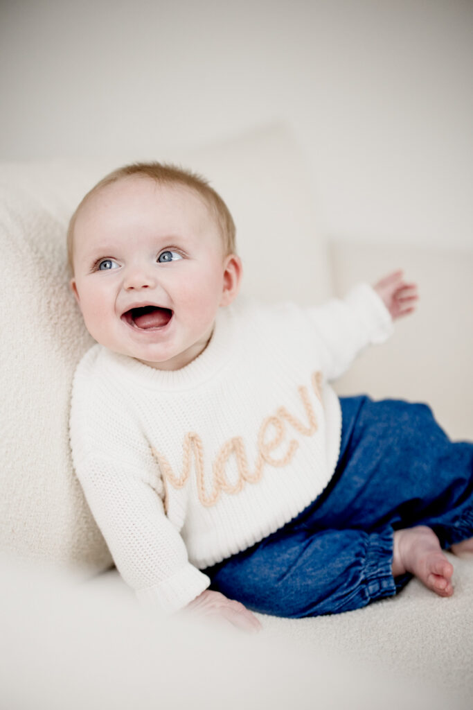 Six month old milestone sesion for little girl with lots of smiles and giggles 